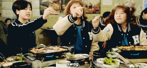 Seon-Ok (Juyoung Lee), Kim Bok Joo and Han-Hee (Cho Hye-Jung) saying Swag in their university's jackets while eating.